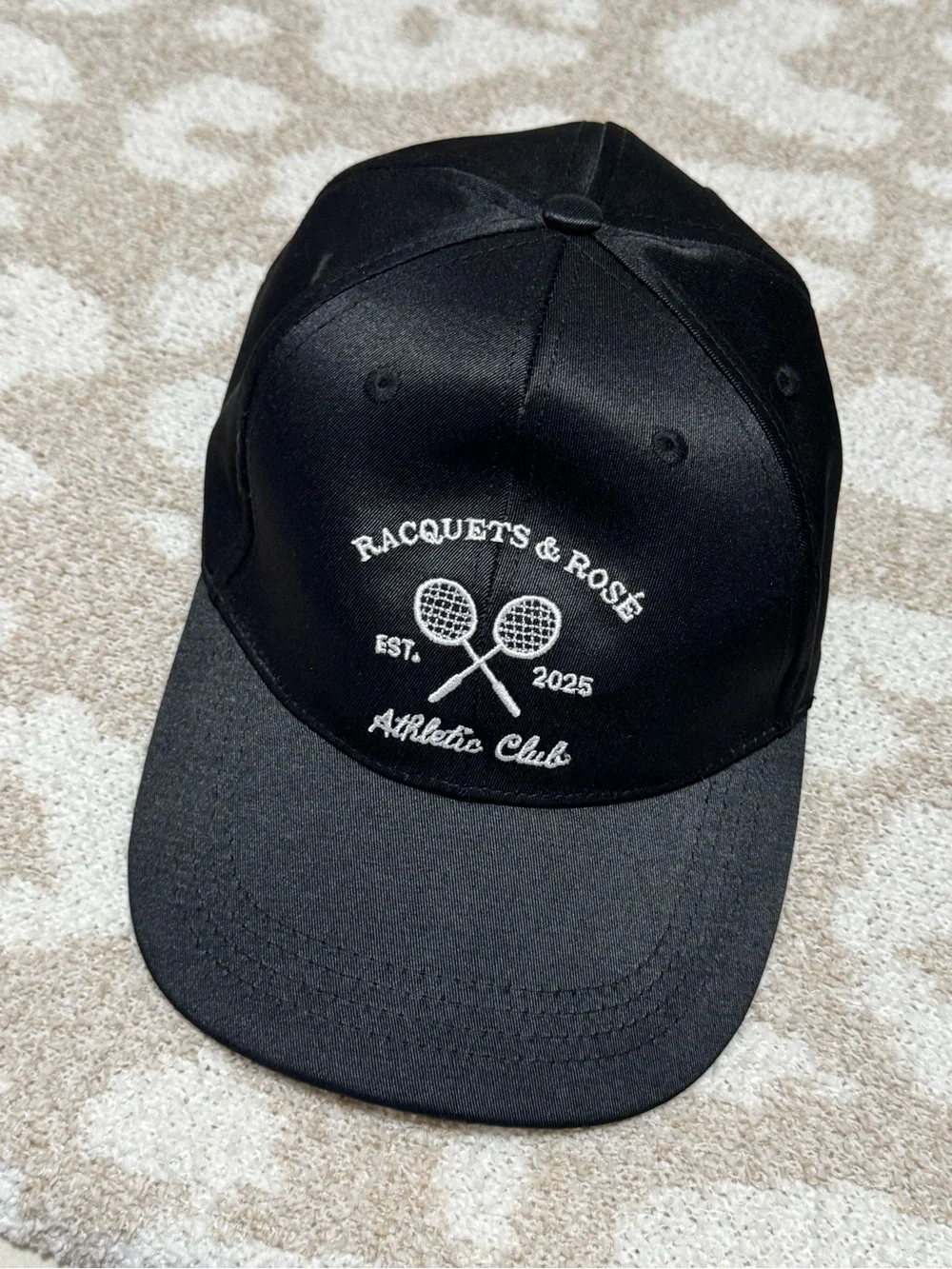 Racquets and roses baseball cap